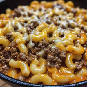Delicious Cheese Steak Hamburger Helper in a bowl garnished with herbs