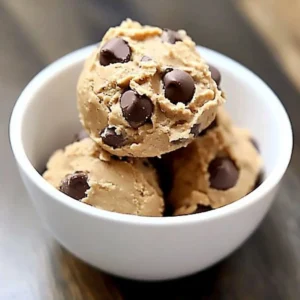 Bowl of Greek Yogurt Cookie Dough with chocolate chips and spoon