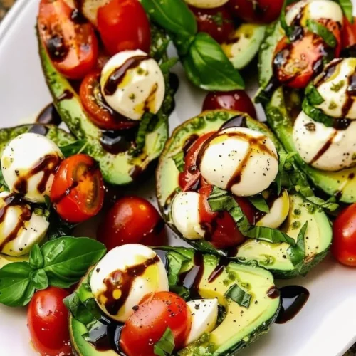 Delicious Avocado Caprese Boats with fresh mozzarella and tomatoes