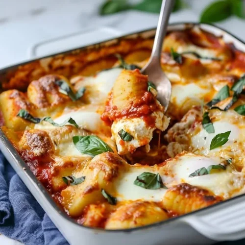 Baked ricotta gnocchi served in a creamy sauce with herbs