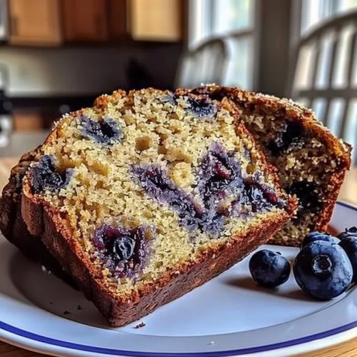 Freshly baked blueberry banana bread sliced and ready to enjoy