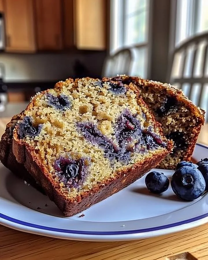Freshly baked blueberry banana bread sliced and ready to enjoy