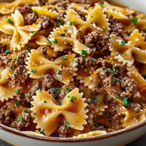 Delicious bowtie pasta dish with ground beef served on a plate