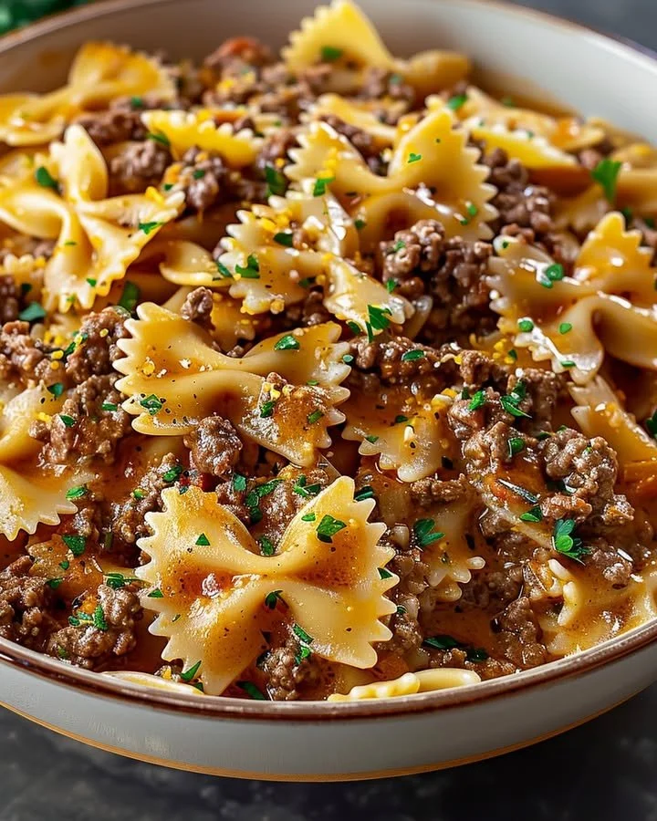 Delicious bowtie pasta dish with ground beef served on a plate