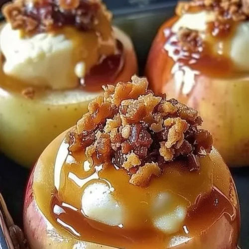 Baked apples filled with creamy cheesecake filling, dessert idea.
