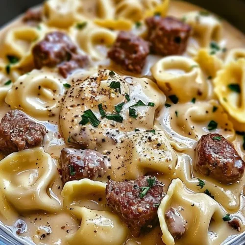 Delicious cheesesteak tortellini served in rich provolone sauce