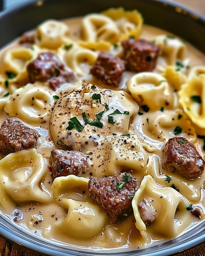 Delicious cheesesteak tortellini served in rich provolone sauce