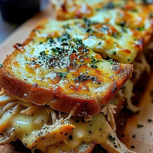 Cheesy chicken garlic bread sandwich with melted cheese and crispy toppings
