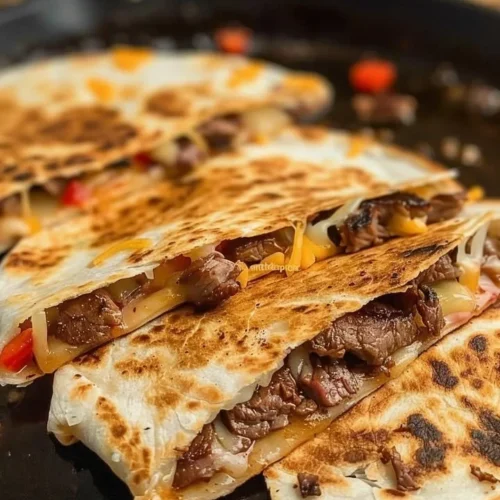 Cheesy steak quesadillas with melted cheese and grilled steak slices