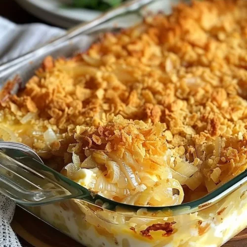 Cheesy Vidalia Onion Casserole served in a baking dish, topped with melted cheese
