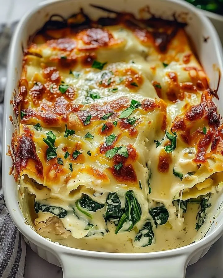 Creamy Chicken Spinach Casserole with cream cheese and spinach on a plate.