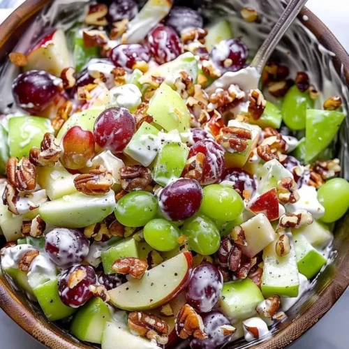 Classic Waldorf Salad with apples, walnuts, and celery served in a bowl