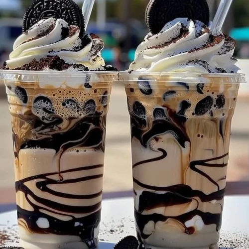 Delicious Cookies & Cream Frappuccino served in a glass with a whipped cream topping
