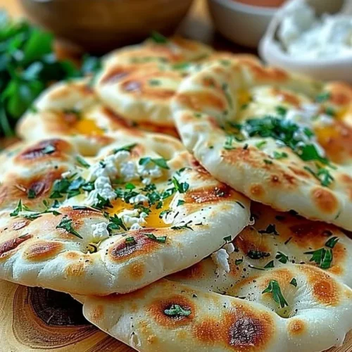 Freshly made cottage cheese flatbread topped with herbs and spices