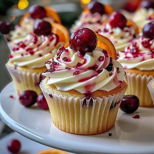 Delicious cranberry orange white chocolate cupcakes topped with festive decorations