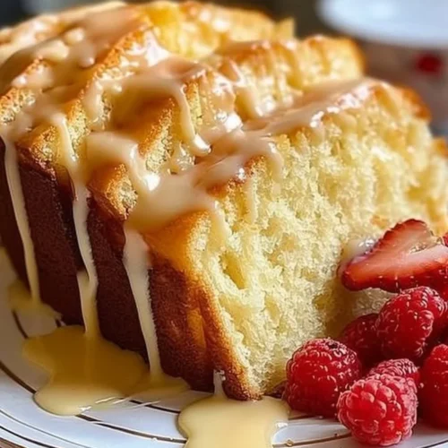 Delicious cream cheese pound cake slice served on a rustic plate