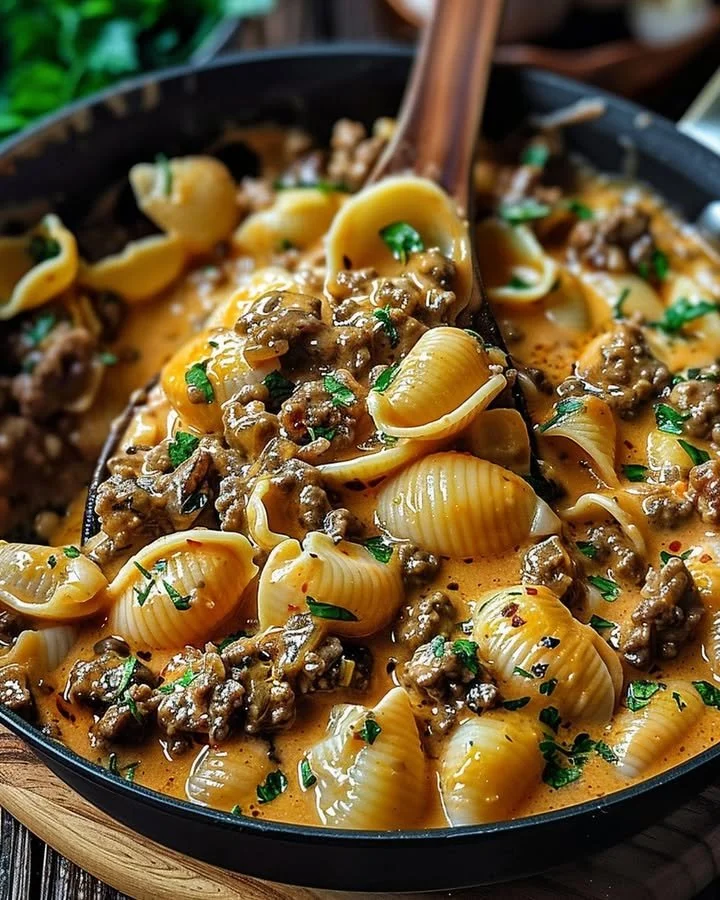 Creamy Beef Shells Casserole with cheese and herbs ready to serve