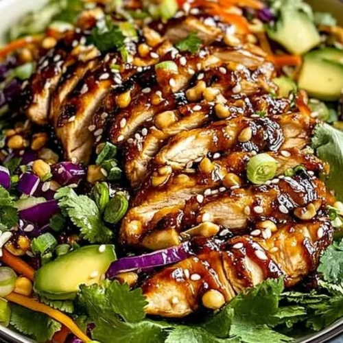 Crunchy Asian Sesame Chicken Salad with vibrant veggies and sesame dressing.