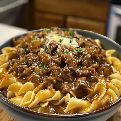 Delicious French onion beef and noodles served in a bowl.