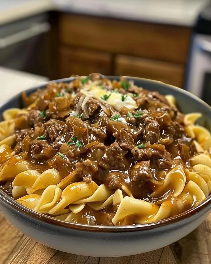 Delicious French onion beef and noodles served in a bowl.
