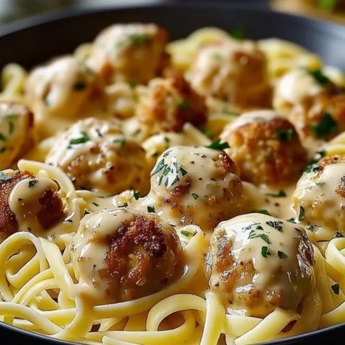 Delicious Garlic Butter Chicken Bites served with creamy Parmesan pasta
