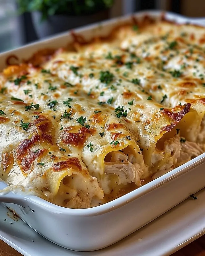 Delicious Garlic Parmesan Chicken Lasagna Roll-Ups topped with cheese