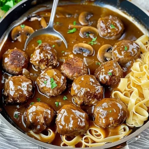 Delicious gourmet meatballs in rich mushroom gravy served on a plate