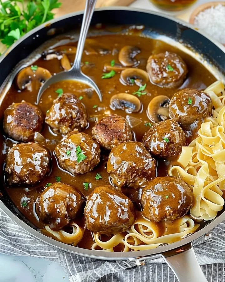 Delicious gourmet meatballs in rich mushroom gravy served on a plate