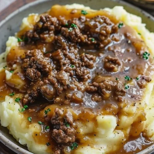 Ground beef and gravy served over creamy mashed potatoes