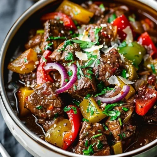 Delicious Guinness Braised Beef Stew in a rustic bowl with fresh herbs