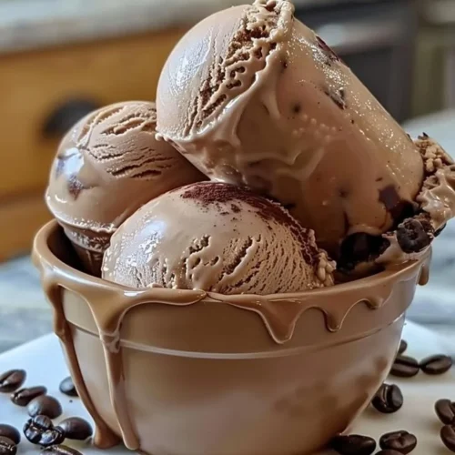 Delicious homemade coffee ice cream in a bowl with coffee beans