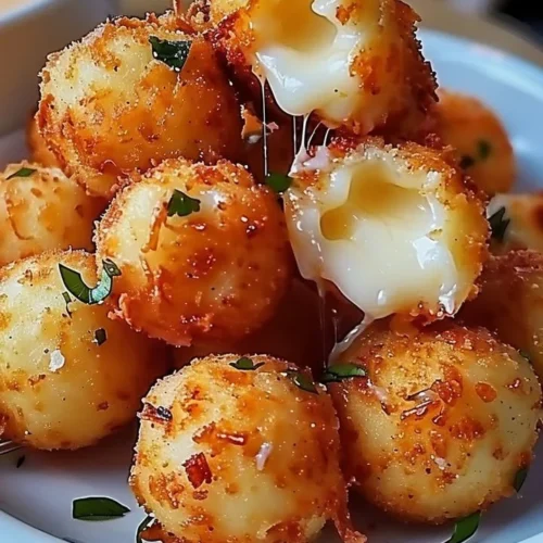 Crispy homemade fried cheese bites served with dipping sauce