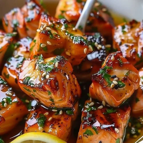 Honey butter garlic glazed salmon bites on a plate