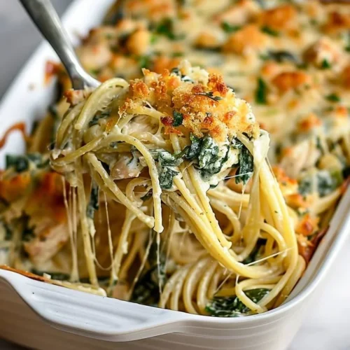 Delicious Monterey Chicken Spaghetti Bake topped with cheese and herbs