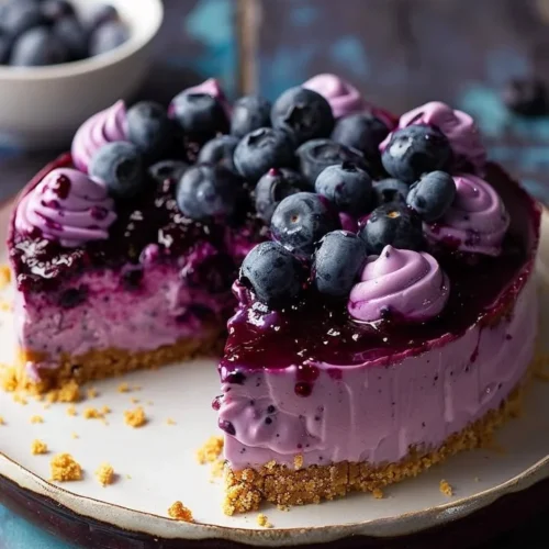 No-Bake Blueberry Cheesecake topped with fresh blueberries
