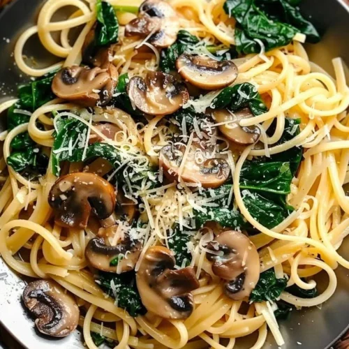 Creamy One Pot Garlic Parmesan Pasta in a bowl with herbs and cheese