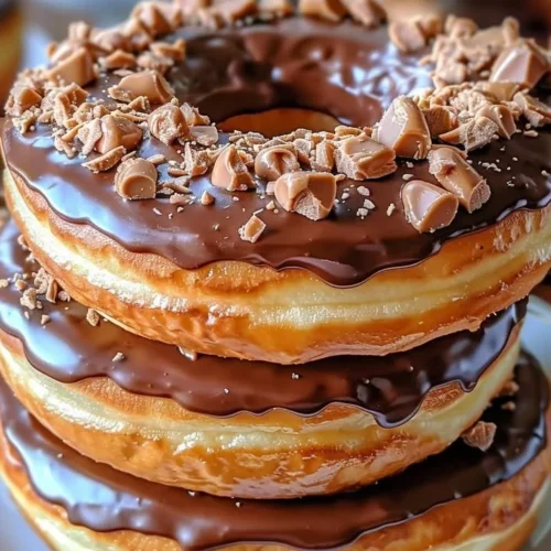 Peanut Butter Reese’s Donut Sandwiches with a chocolate drizzle