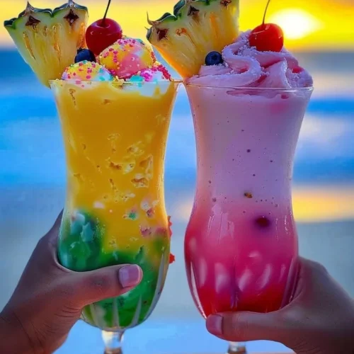 Delicious Rainbow Sherbet Piña Colada drink topped with vibrant colors