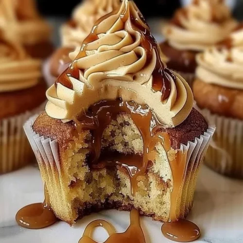 Delicious homemade salted caramel cupcakes topped with creamy frosting.