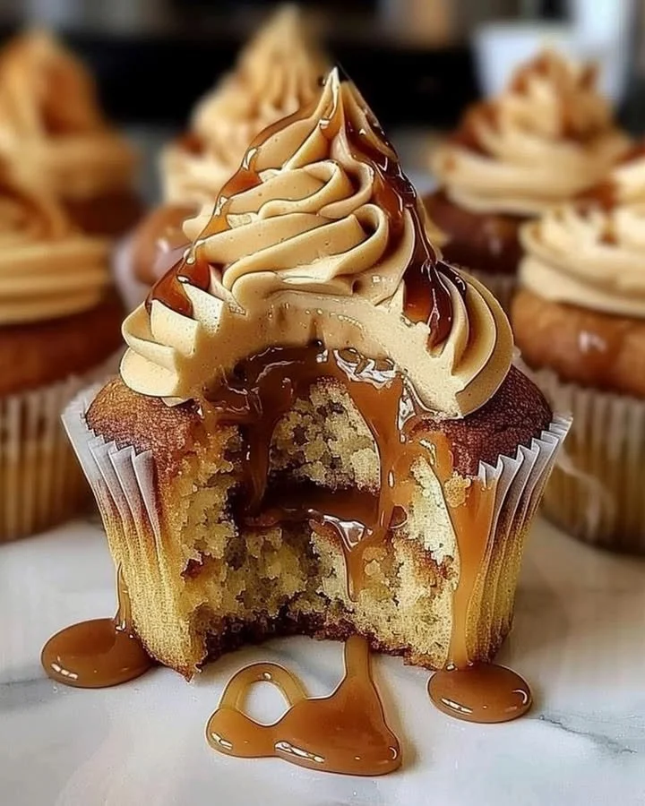 Delicious homemade salted caramel cupcakes topped with creamy frosting.