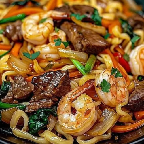 Delicious Steak and Shrimp Stir-Fried Noodles served in a bowl
