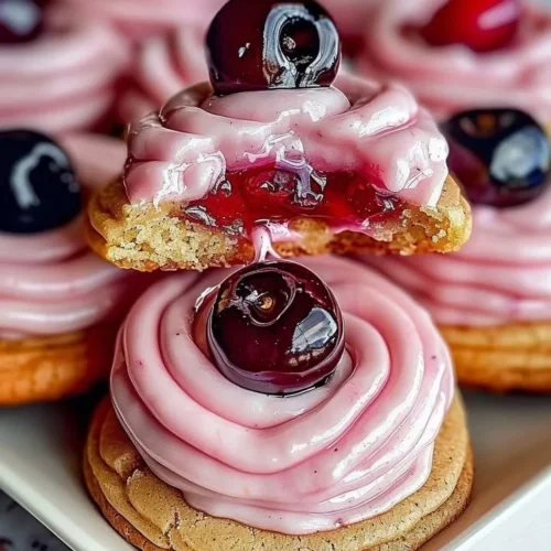 Delicious Strawberry Frosted Cherry Cookies served on a plate.