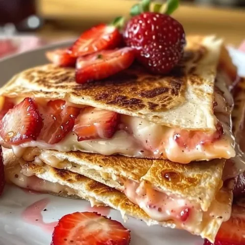 Delicious strawberry cheesecake quesadillas filled with cream cheese and strawberries