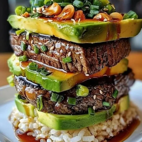 Teriyaki Beef and Avocado Rice Stack with fresh ingredients