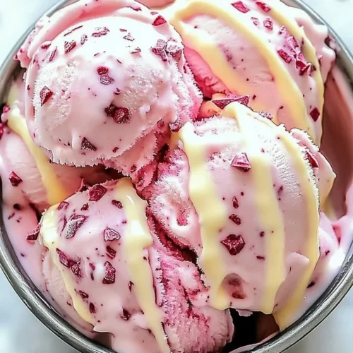 Delicious Velvet Ice Cream topped with white chocolate shavings