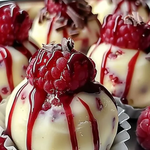 Delicious white chocolate raspberry cheesecake balls on a plate