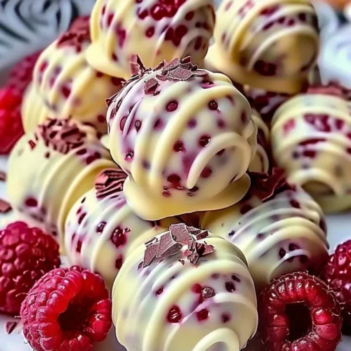 Delicious white chocolate raspberry cheesecake balls served on a plate